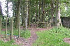 Woodland Adventure Playground - which contains wooden play equipment, including swings, tyre swings, balance boards and tunnels